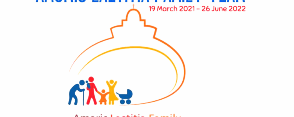 Graphic of the Amoris Laetitia Family Year. There is an image of four figures and a pram. The figures are a man using a cane, a man holding the hand of a child and a woman with her arms up beside the pram. They are on a circuit to a building which outlines the church and has a holy cross at the top of it. At the top the dates are shown, the 19th of March 2021 to the 26th of June 2022.