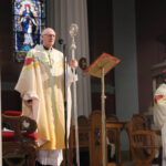 Graphic of newly appointed Archbishop Dermot Farrell speaking to the congregation in his new gown.