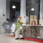 Graphic of Archbishop Dermot Farrell standing at the altar with a priest in the background.