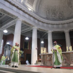 Graphic of archbishop Farrell and His Excellency Archbishop Jude Thaddeus Okolo, Apostolic Nuncio to Ireland standing at the altar for the Imposition of the Pallium on Archbishop Farrell.