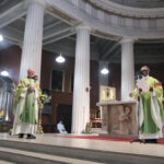 Graphic of archbishop Farrell and His Excellency Archbishop Jude Thaddeus Okolo, Apostolic Nuncio to Ireland standing at the altar for the Imposition of the Pallium on Archbishop Farrell.
