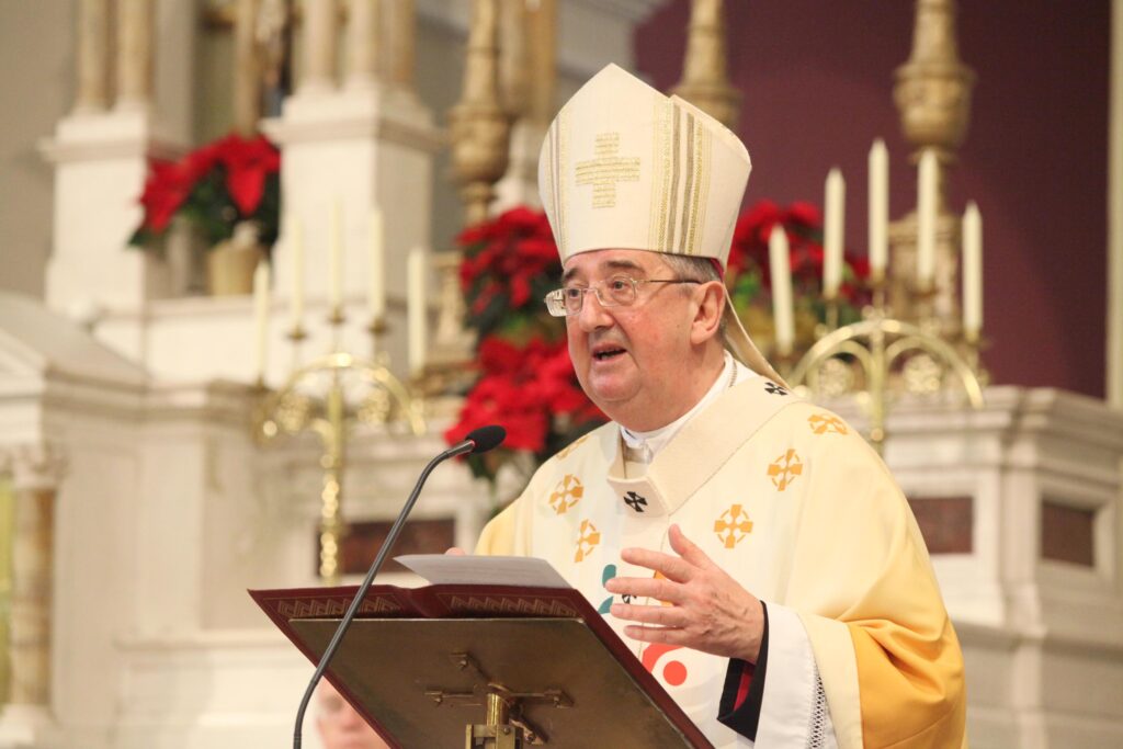 Picture shows Archbishop Diarmuid Martin speaking at the end of the World Day of Peace Mass in the Church of the Three Patrons Rathgar in Dublin on New Year's Day. He is wearing a white robe and headpiece and addressing the congregation from the altar stand.