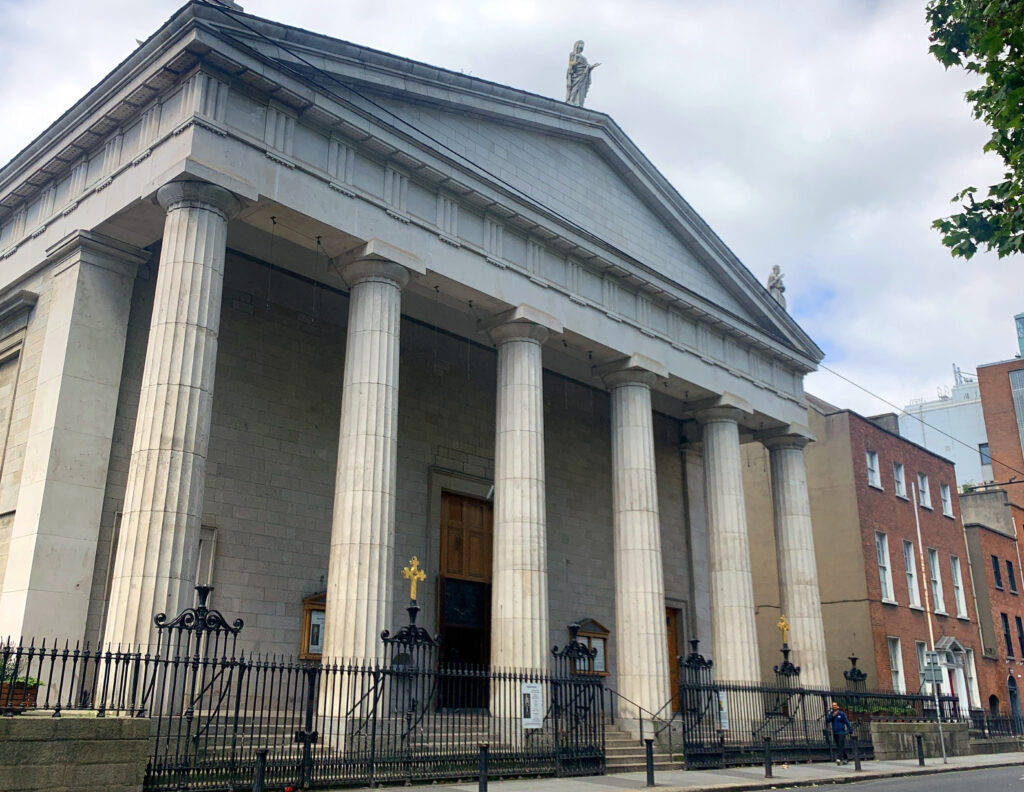 Graphic of St Mary’s Pro-Cathedral, Dublin on November 11, 2023. There are religious statues at the top of the cathedral and six large pillars at the entrance.