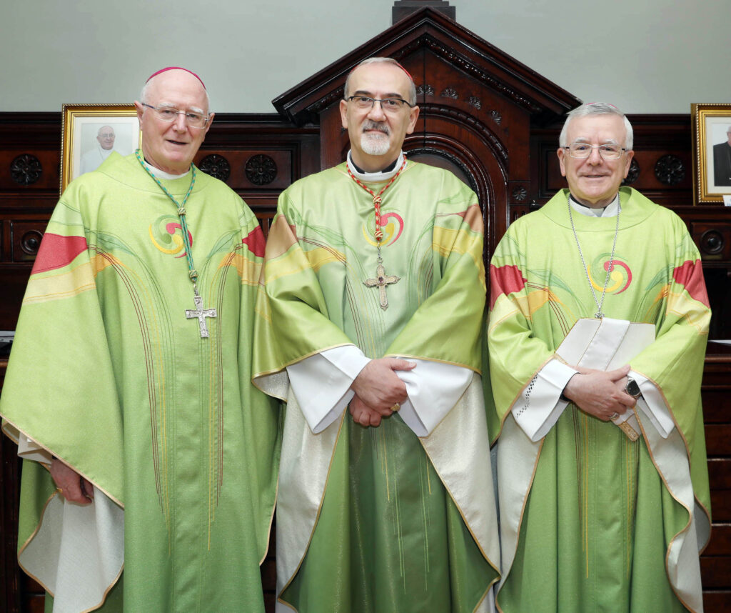 Picture shows Cardinal Pierbattista Pizzaballa Latin Patriarch of Jerusalem (centre) with Archbishop Dermot Farrell, Archbishop of Dublin and Apostolic Nuncio to Ireland, Archbishop Luis Mariano Montemayor photographed before the mass on Sunday morning. They are wearing their green, yellow and red robes and smiling towards the camera.