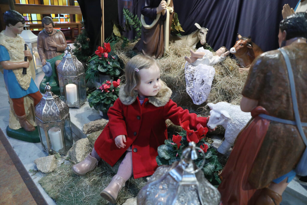 Picture of Clodagh Coffey at the crib after the World Day of Peace Mass in Ballyroan.