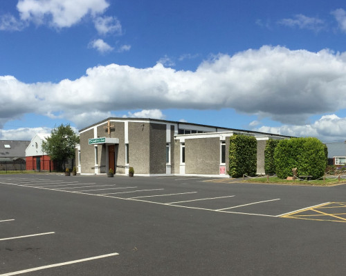 Graphic of Mass for those unlawfully killed in the Stardust fire which took place in the Church of St Joseph the Artisan, Bonnybrook on Saturday, 20th April 2024. Graphic shows St Joseph the Artisan's Church and a cloudy blue sky.