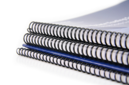 Graphic of three ring bound copies placed on top of each other with a normal blue copy.